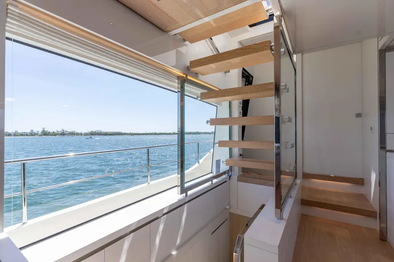 Sasa Yacht Photos Pics Interior of 2022 Sanlorenzo SL86 yacht with modern staircase and ocean view.