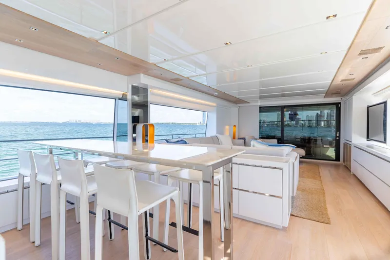 Sasa Yacht Photos Pics Luxurious interior of 2022 Sanlorenzo SL86 yacht with modern dining area and ocean view.