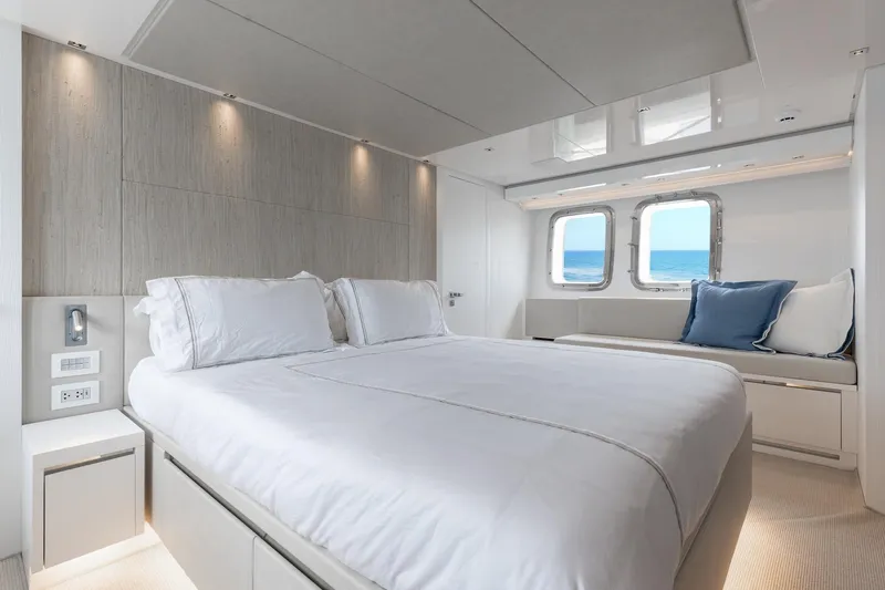 Sasa Yacht Photos Pics Luxurious bedroom interior of 2022 Sanlorenzo SL86 yacht with ocean view windows.