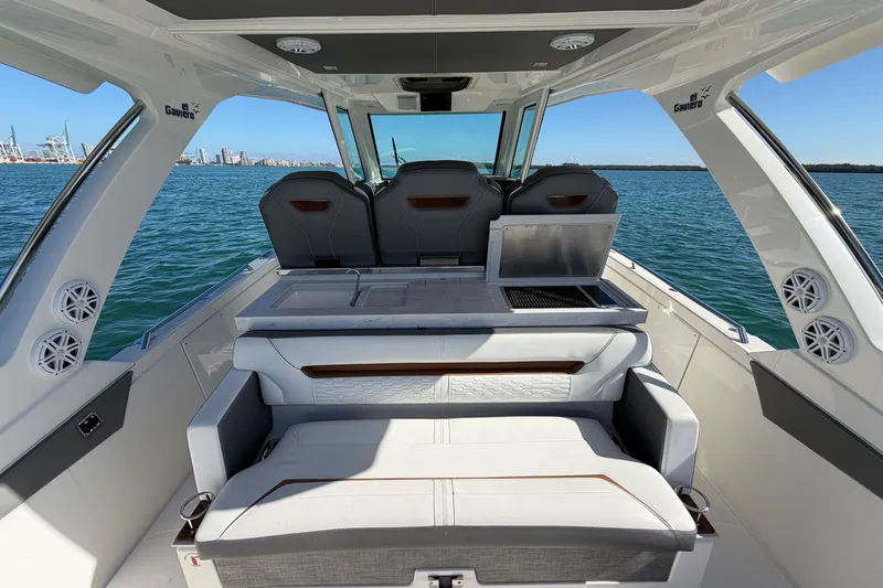  Yacht Photos Pics 2022 Tiara Yachts 34 LS interior with seating and ocean view.