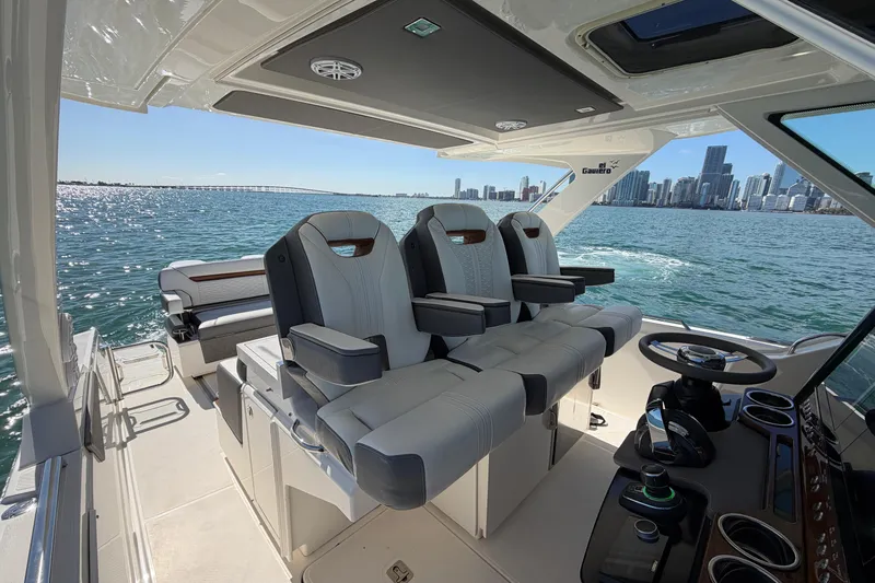  Yacht Photos Pics 2022 Tiara Yachts 34 LS interior with luxurious seating and city skyline view.