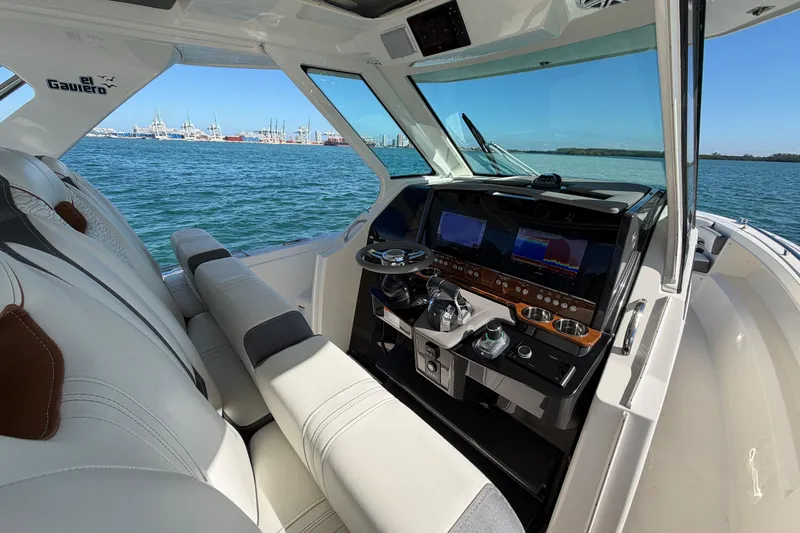  Yacht Photos Pics 2022 Tiara Yachts 34 LS helm with modern controls and ocean view.