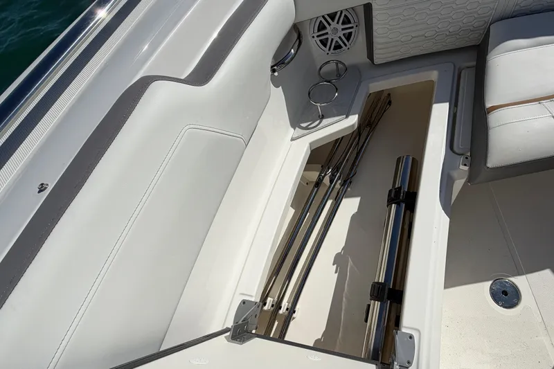 Yacht Photos Pics 2022 Tiara Yachts 34 LS interior storage compartment with fishing rod holders.