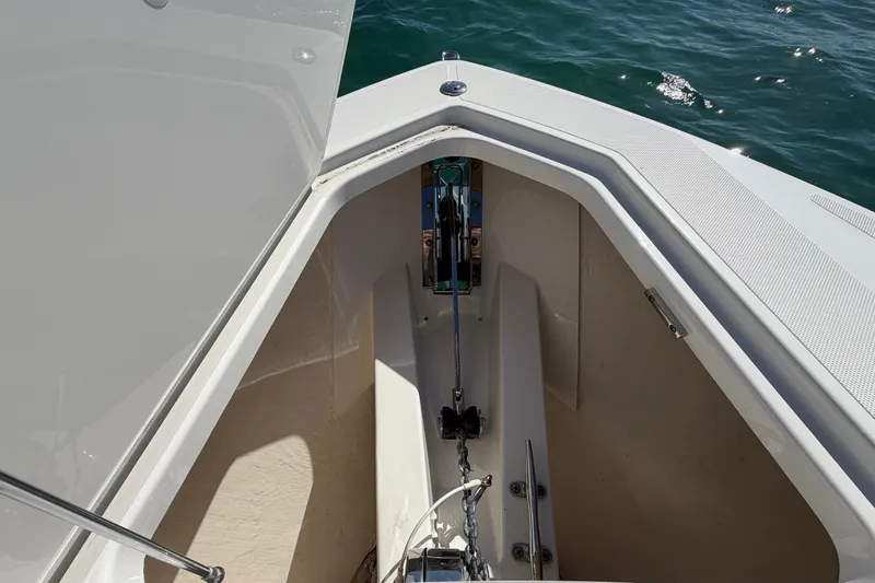  Yacht Photos Pics Anchor compartment of 2022 Tiara Yachts 34 LS, open hatch, ocean background.