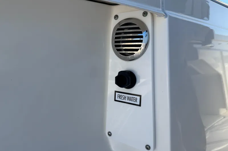  Yacht Photos Pics Tiara Yachts 34 LS 2022 fresh water outlet with vent on white surface.