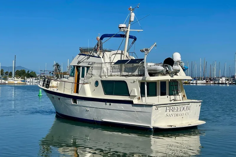Freedom Yacht Photos Pics 1976 Hatteras 48 Long Range Cruiser docked in San Diego marina.
