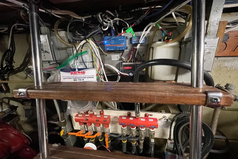 Freedom Yacht Photos Pics Engine room of a 1976 Hatteras 48 Long Range Cruiser with wiring and control panels.