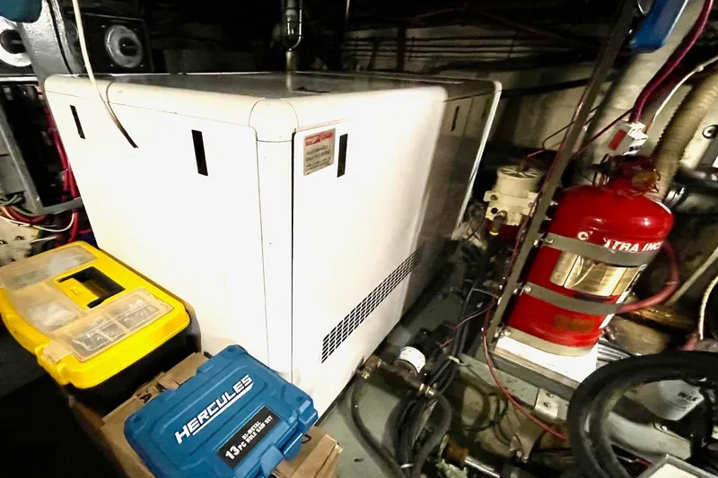 Freedom Yacht Photos Pics Engine room of 1976 Hatteras 48 Long Range Cruiser with equipment and tools.