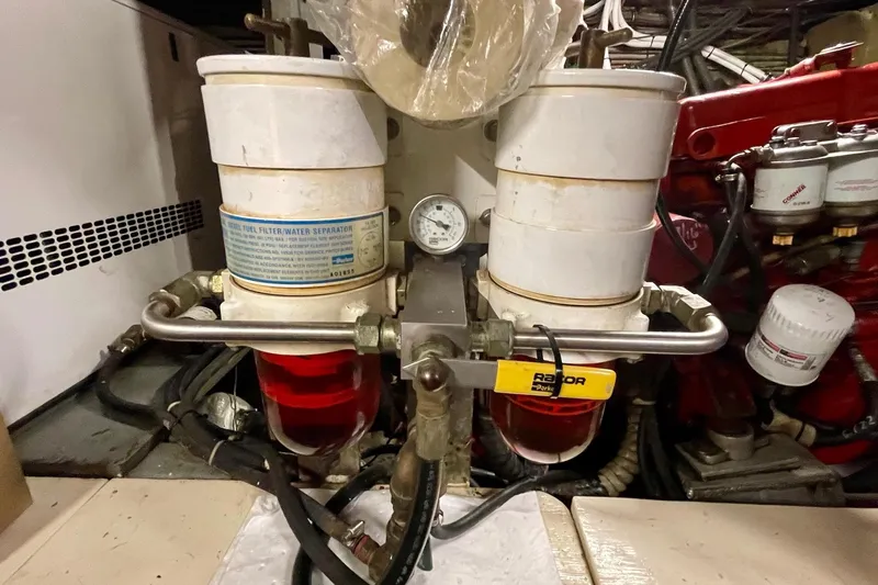 Freedom Yacht Photos Pics Engine room of 1976 Hatteras 48 Long Range Cruiser with fuel filter system.