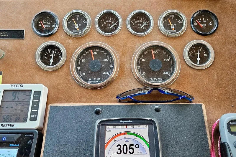 Freedom Yacht Photos Pics Dashboard of a 1976 Hatteras 48 Long Range Cruiser with gauges and navigation equipment.
