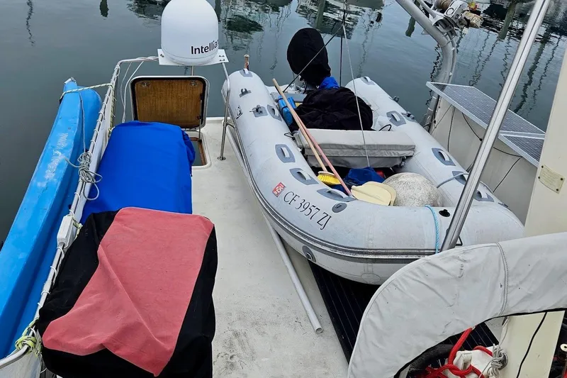 Freedom Yacht Photos Pics 1976 Hatteras 48 Long Range Cruiser with inflatable dinghy on deck.