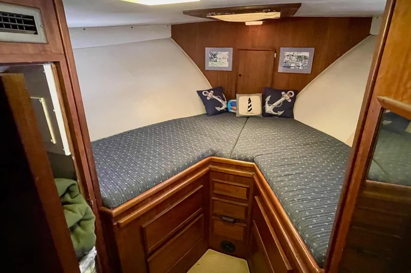 Freedom Yacht Photos Pics Cozy cabin interior of 1976 Hatteras 48 Long Range Cruiser with nautical decor.