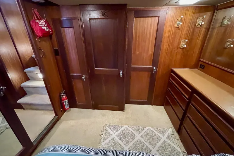Freedom Yacht Photos Pics Interior of 1976 Hatteras 48 Long Range Cruiser with wood paneling and storage.