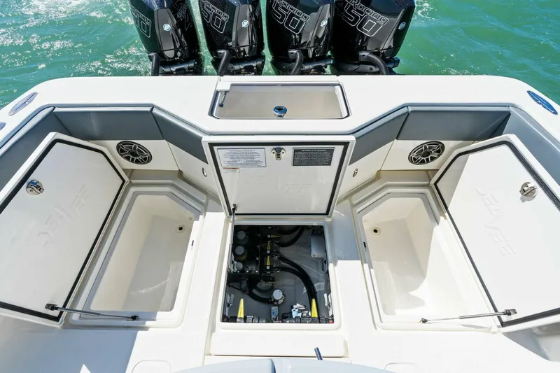  Yacht Photos Pics 2021 SeaVee 390Z boat stern with open storage compartments and four outboard engines.