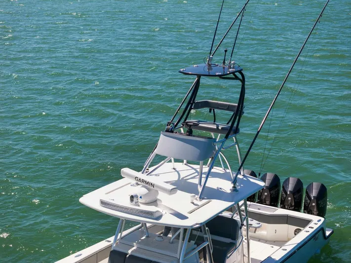  Yacht Photos Pics 2021 SeaVee 390Z boat with Garmin radar and multiple outboard engines on the water.