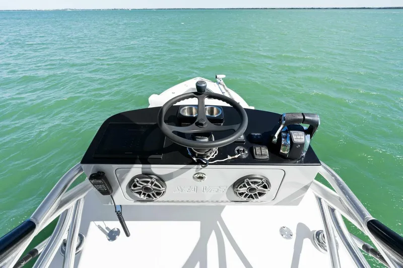  Yacht Photos Pics 2021 SeaVee 390Z boat helm with steering wheel and controls on open water.