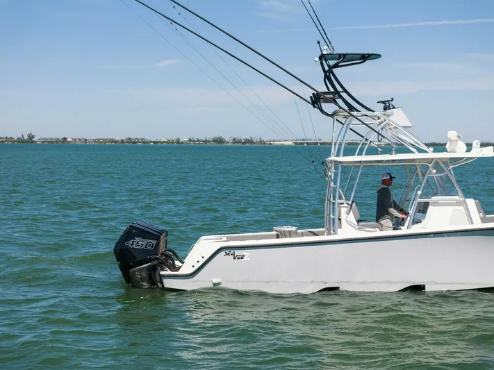  Yacht Photos Pics 2021 SeaVee 390Z boat on water with outboard motor.