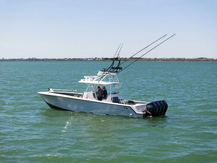  Yacht Photos Pics 2021 SeaVee 390Z boat on open water with fishing rods.