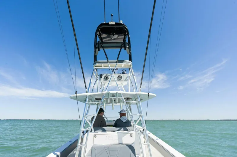  Yacht Photos Pics 2021 SeaVee 390Z boat on open water with two people onboard.