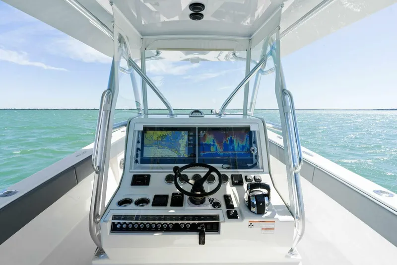  Yacht Photos Pics 2021 SeaVee 390Z boat dashboard with navigation screens on open water.