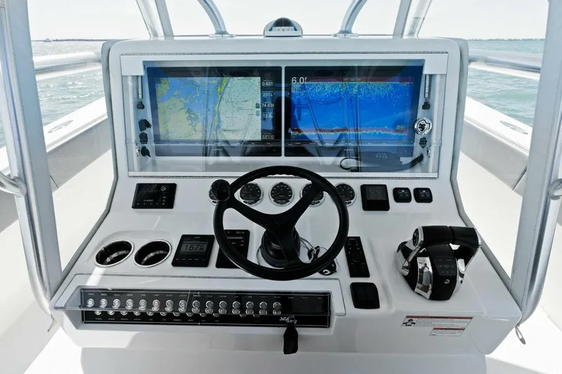  Yacht Photos Pics 2021 SeaVee 390Z boat dashboard with dual navigation screens and controls.