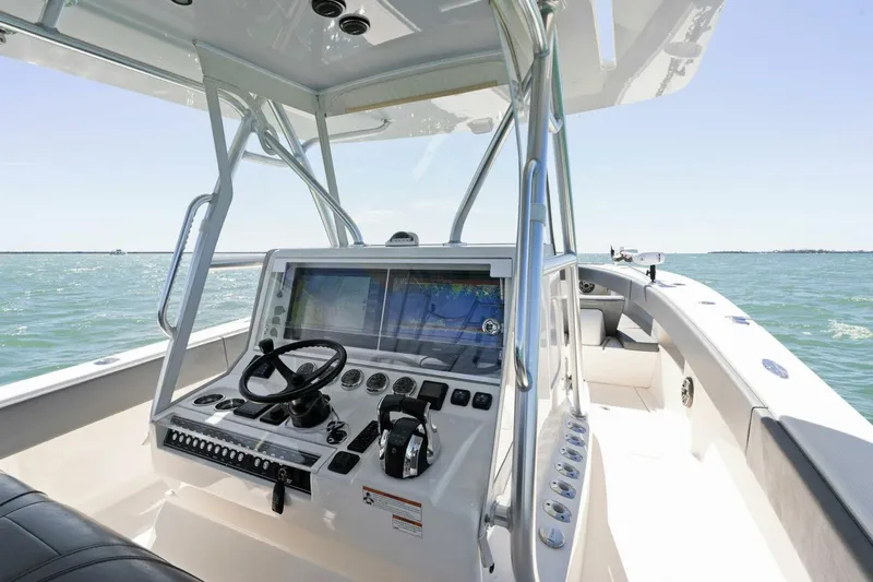  Yacht Photos Pics 2021 SeaVee 390Z boat cockpit with advanced navigation system and steering wheel.