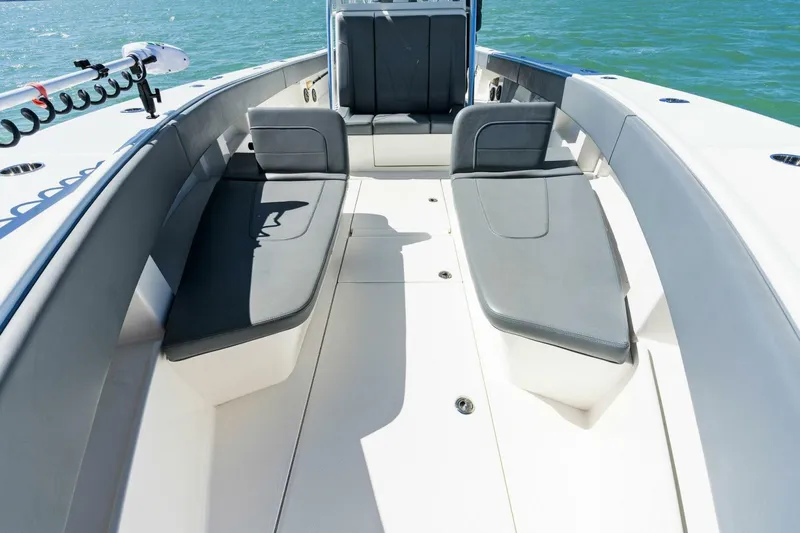  Yacht Photos Pics 2021 SeaVee 390Z boat interior with cushioned seating and ocean backdrop.
