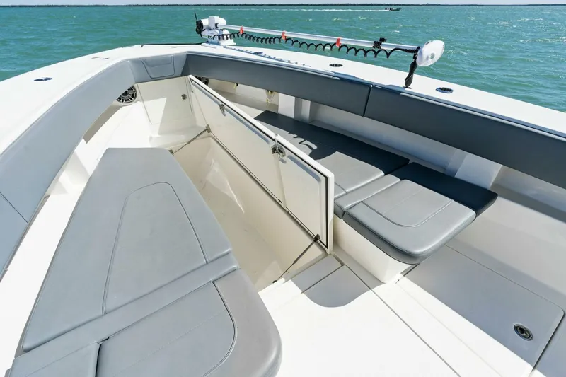  Yacht Photos Pics 2021 SeaVee 390Z boat interior with cushioned seating and storage compartments.
