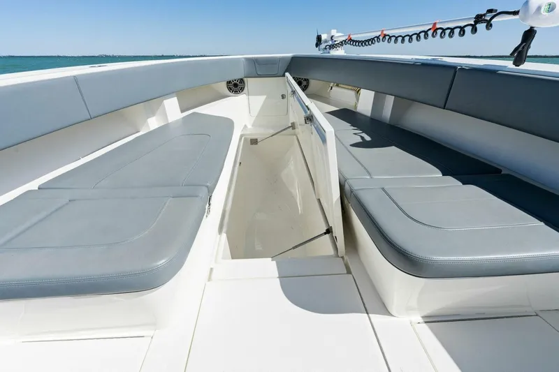  Yacht Photos Pics 2021 SeaVee 390Z boat interior with cushioned seating and storage compartments.