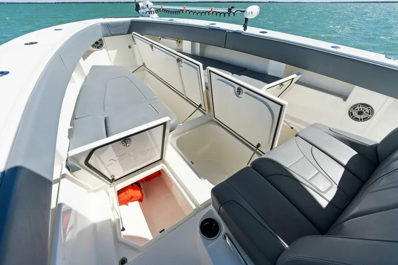  Yacht Photos Pics 2021 SeaVee 390Z boat with open storage compartments and seating area.