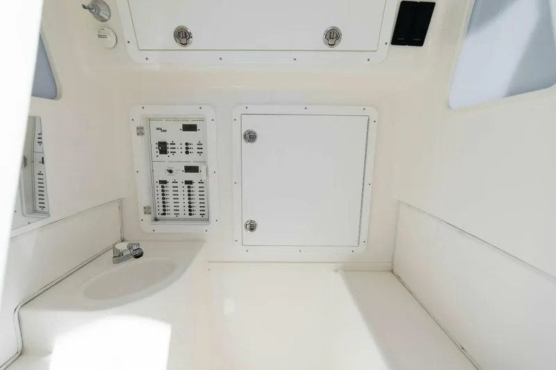  Yacht Photos Pics Interior view of 2021 SeaVee 390Z boat showing control panel and storage compartments.