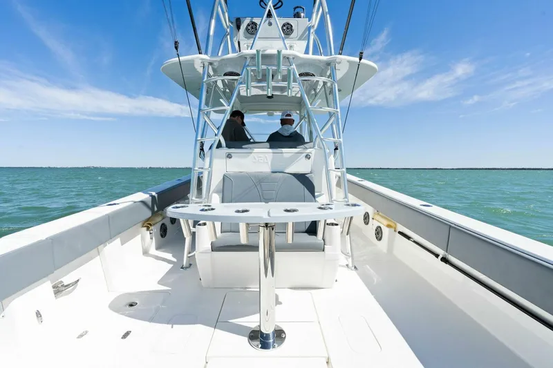  Yacht Photos Pics 2021 SeaVee 390Z boat on open water with two people seated.