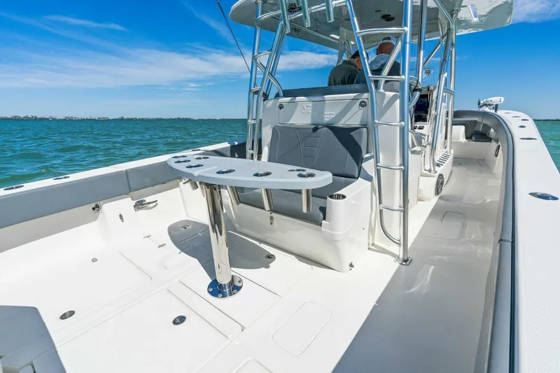  Yacht Photos Pics 2021 SeaVee 390Z boat interior with seating and fishing rod holders on a sunny day.