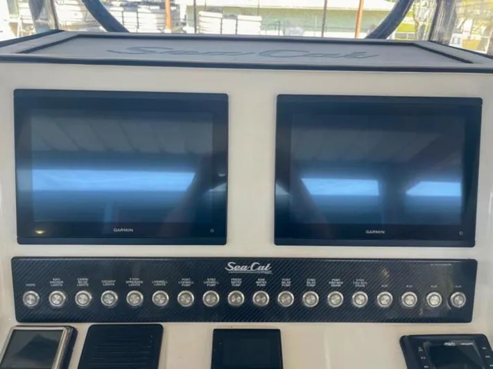  Yacht Photos Pics 2024 Sea Cat 262 HC dashboard with dual Garmin displays and control panel.