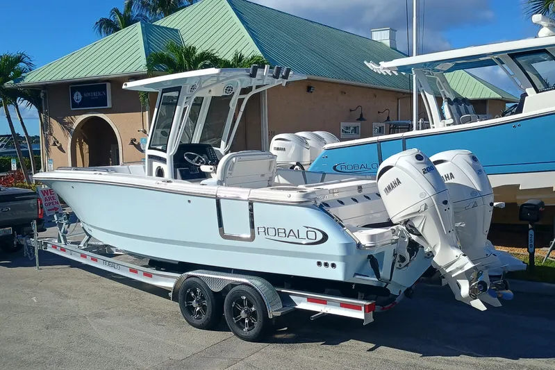 250-118 Yacht Photos Pics 2026 Robalo R250 Center Console boat with twin Yamaha engines on a trailer.