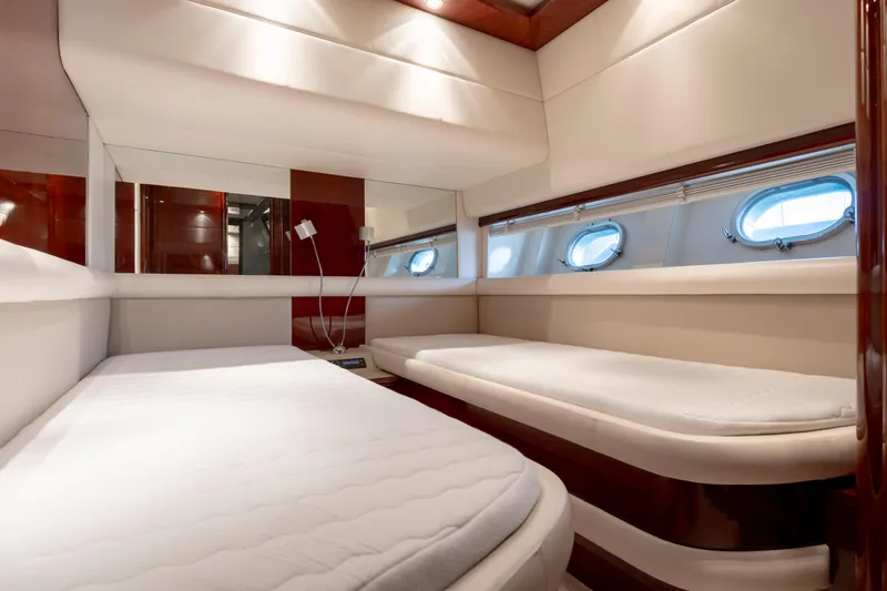 Cool Running Yacht Photos Pics Luxurious cabin interior of 2003 Mochi Craft 22.5 Axis yacht with twin beds.
