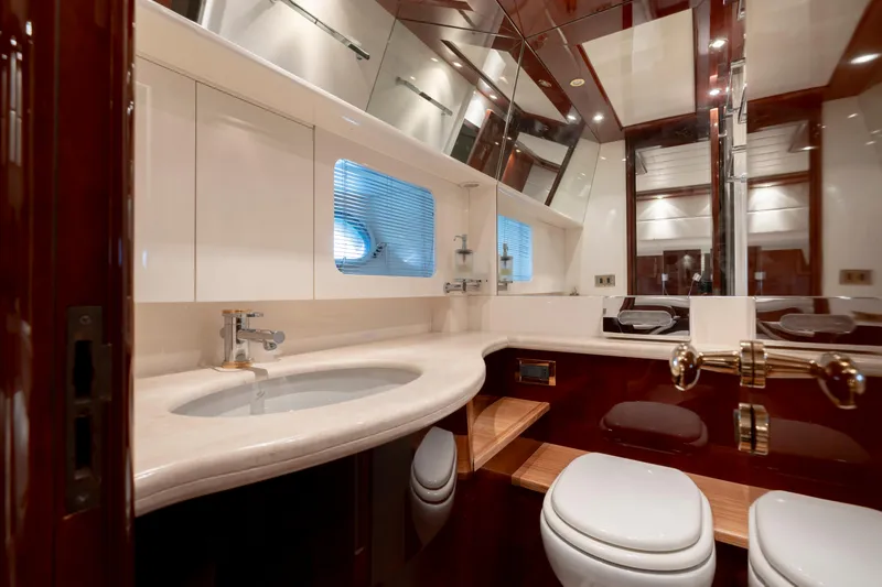 Cool Running Yacht Photos Pics Luxurious bathroom in 2003 Mochi Craft 22.5 Axis yacht with modern fixtures and elegant design.