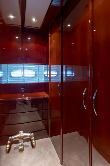 Cool Running Yacht Photos Pics Luxurious wooden interior of 2003 Mochi Craft 22.5 Axis yacht with elegant cabinetry and lighting.