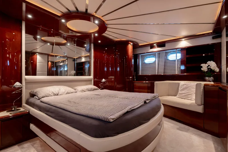 Cool Running Yacht Photos Pics Luxurious bedroom interior of 2003 Mochi Craft 22.5 Axis yacht with elegant wood finishes.