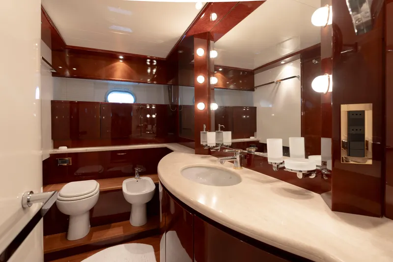 Cool Running Yacht Photos Pics Luxurious bathroom in 2003 Mochi Craft 22.5 Axis yacht with elegant wood finishes.