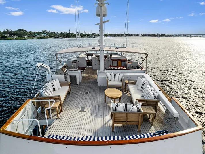 Chanticleer Yacht Photos Pics Luxurious 1973 Burger 310C yacht deck with elegant seating and ocean view.