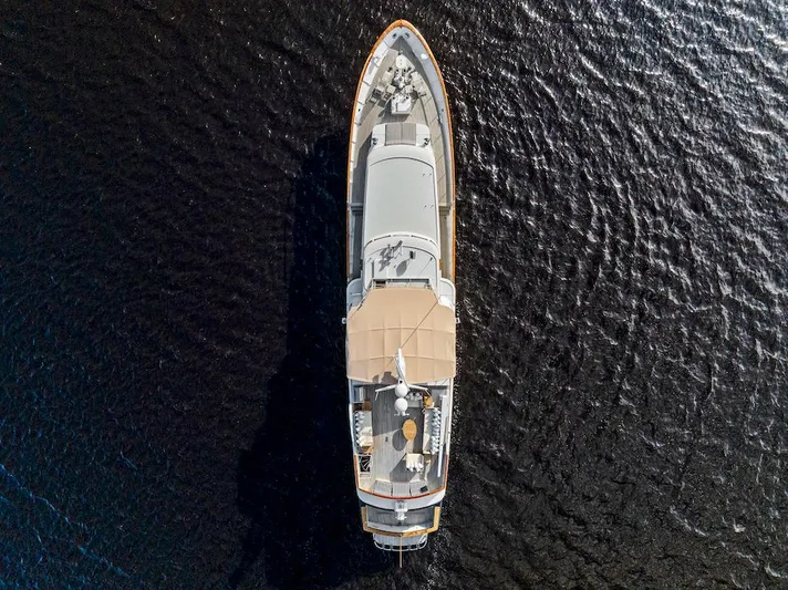 Chanticleer Yacht Photos Pics Aerial view of 1973 Burger 310C yacht on dark water.