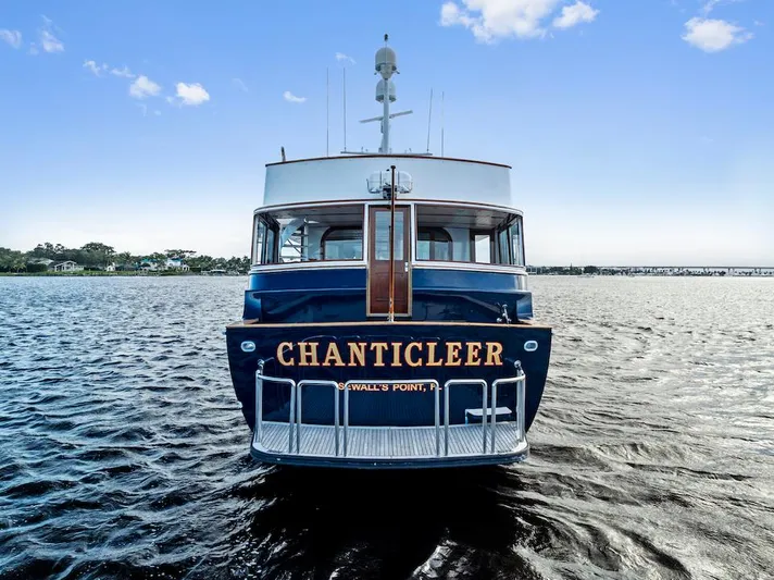 Chanticleer Yacht Photos Pics Front view of 1973 Burger 310C yacht "CHANTICLEER" on open water.