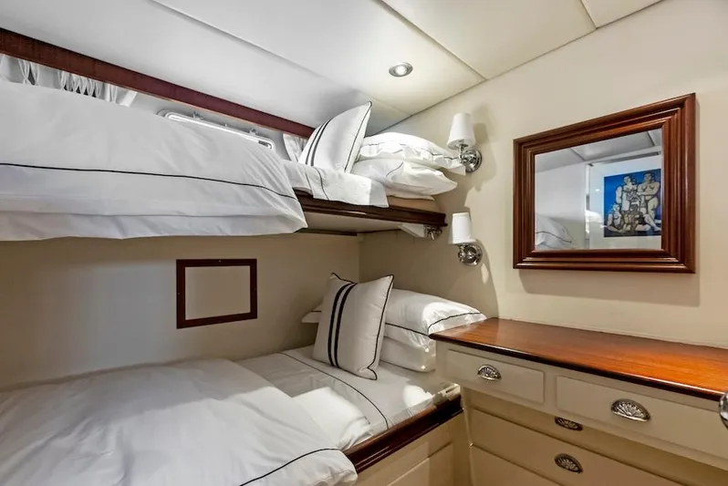 Chanticleer Yacht Photos Pics Cozy 1973 Burger 310C yacht cabin with bunk beds and elegant wooden furnishings.