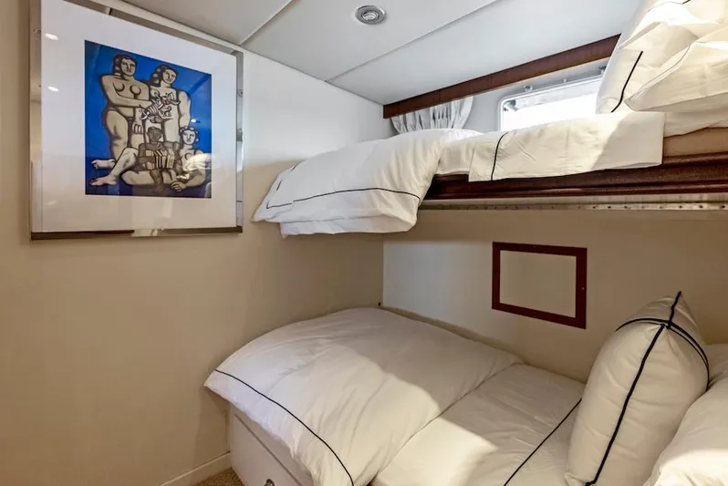 Chanticleer Yacht Photos Pics Cozy 1973 Burger 310C yacht cabin with bunk beds and framed artwork.