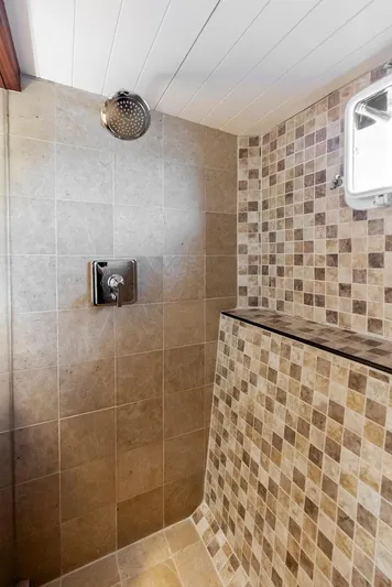 Chanticleer Yacht Photos Pics Vintage 1973 Burger 310C yacht shower with modern tile design and chrome fixtures.