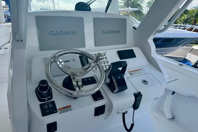  Yacht Photos Pics Helm of 2026 Intrepid 375 Nomad SE with Garmin displays and Mercury controls.