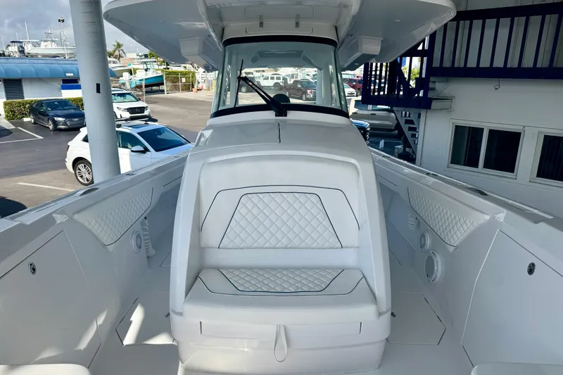  Yacht Photos Pics 2026 Intrepid 375 Nomad SE boat interior with white seating and modern design.