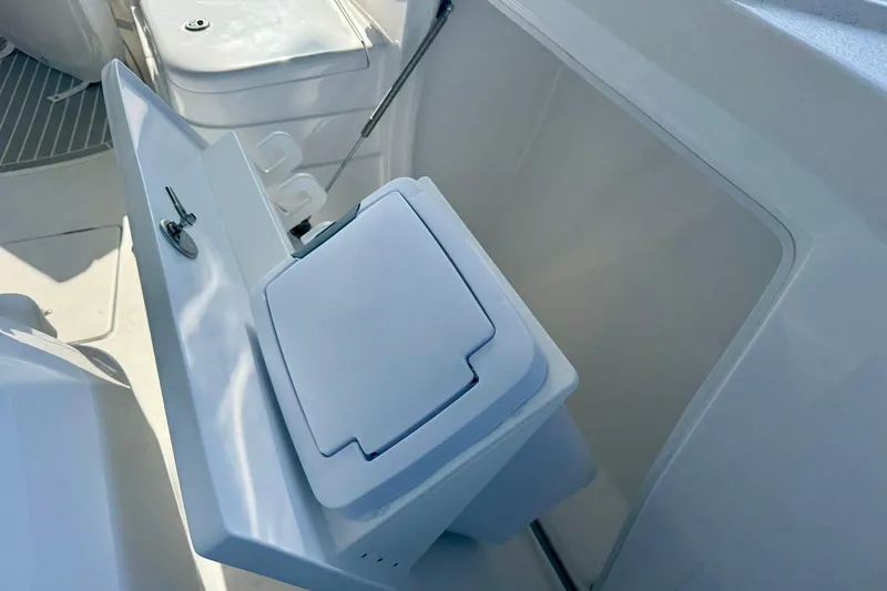  Yacht Photos Pics 2026 Intrepid 375 Nomad SE boat interior with open storage compartment.