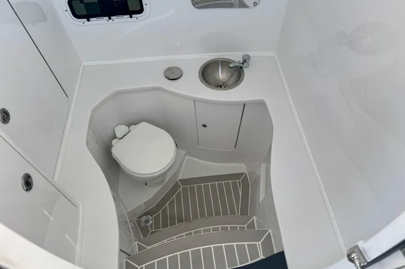  Yacht Photos Pics 2026 Intrepid 375 Nomad SE boat bathroom with toilet and sink.